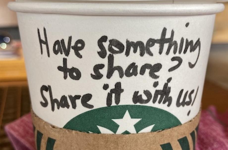  A starbucks coffee cup with the words 